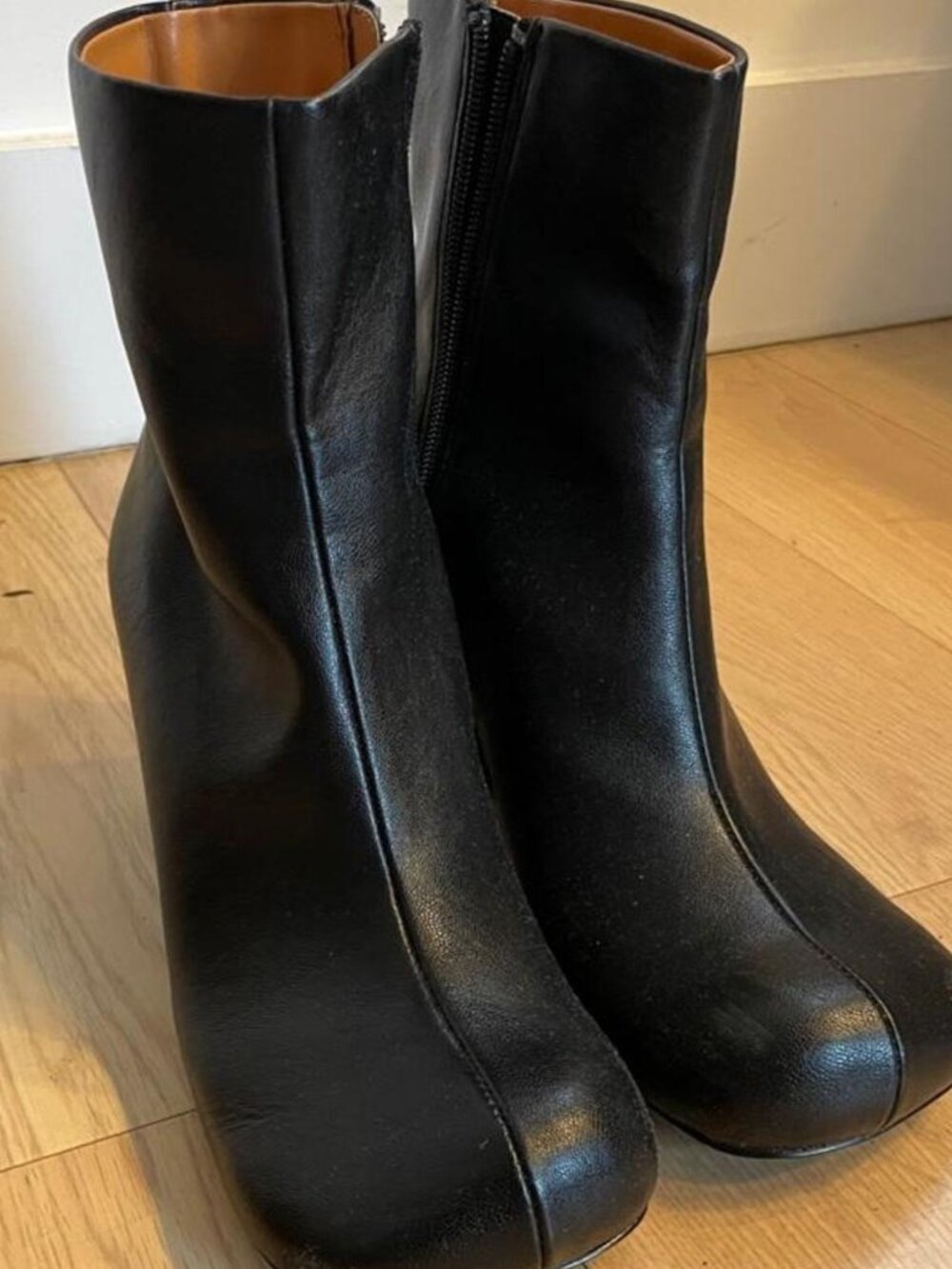 Black vegan leather ankle boots with a 3.5" heel. Similar to Maison Margeila